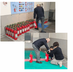 Two photographs showing a man in a suit handling fire extinguishers. In the top image, he arranges extinguishers against a wall with a fire safety poster. In the bottom image, he assists another person kneeling on the ground, possibly demonstrating extinguisher use.